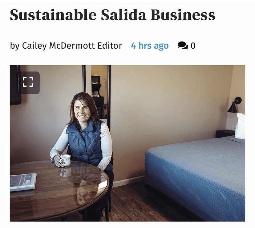 Woodland Motel – Downtown Salida Colorado Motel Hotel - article featured image of Joni sitting inside one of the motel rooms