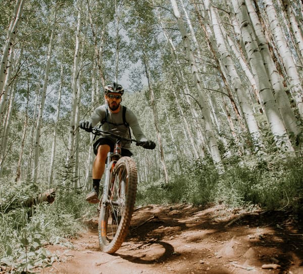 Things to do in Salida Colorado - Woodland Motel Downtown Salida - mountain biker on trail