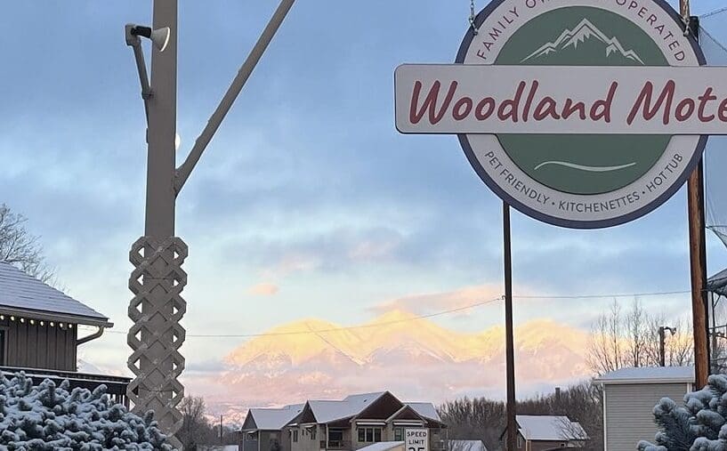 Snowy view of the woodland motel sign salida colorado