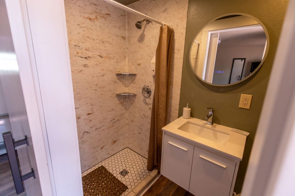 Woodland Motel – Downtown Salida Colorado Motel Hotel - Updated bathroom with walk in tiled shower