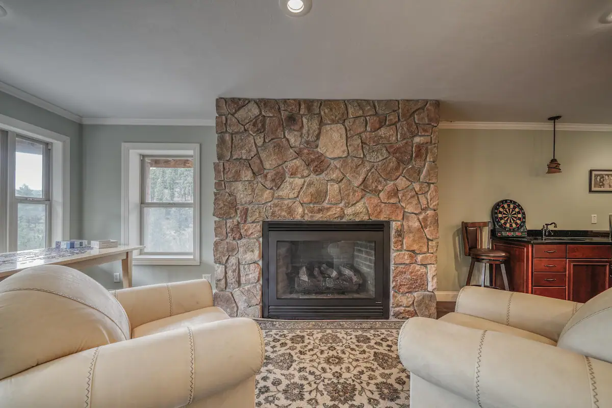 Vacation Rental in Salida Colorado with Mountain Views - downstairs living room fireplace